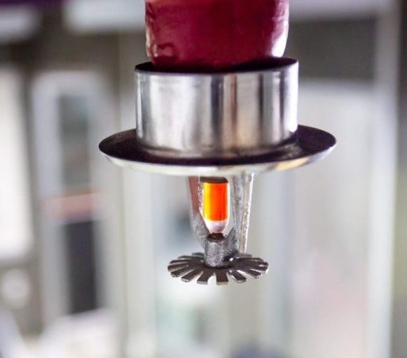 Close-up of a commercial fire sprinkler head used in an automatic fire sprinkler system protecting a commercial building in the Greater Chicago area.