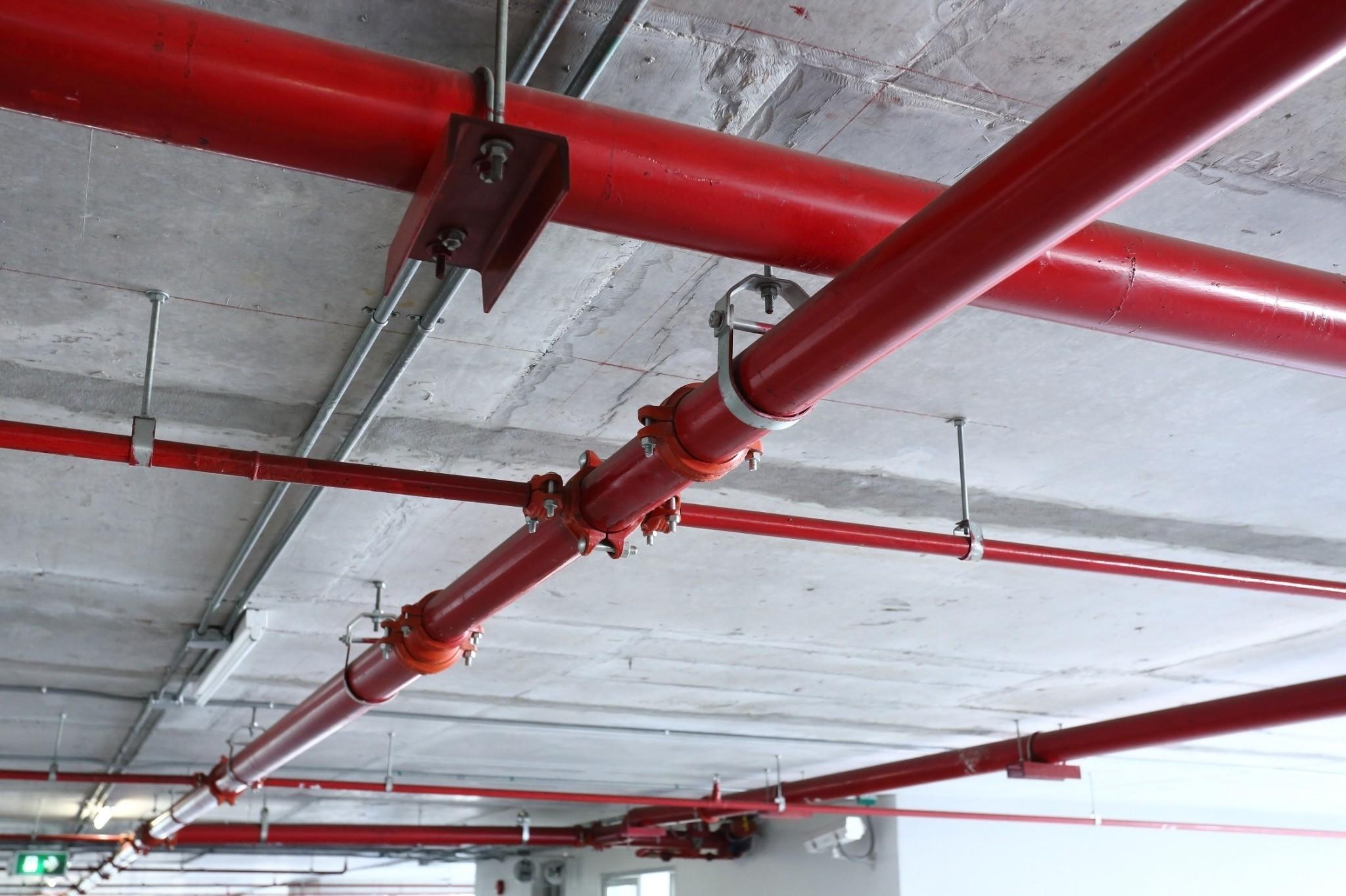 Commercial fire sprinkler piping installed throughout a building ceiling