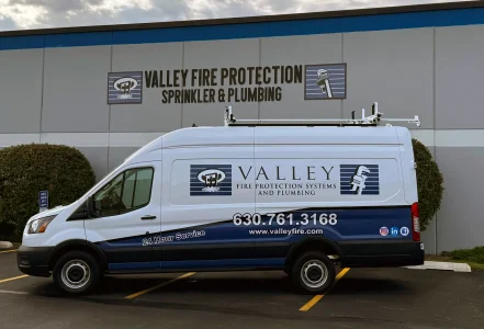 Valley Fire Protection service van parked outside company headquarters in St. Charles, Illinois, providing commercial fire protection, fire sprinkler, and plumbing services throughout the Greater Chicago area.